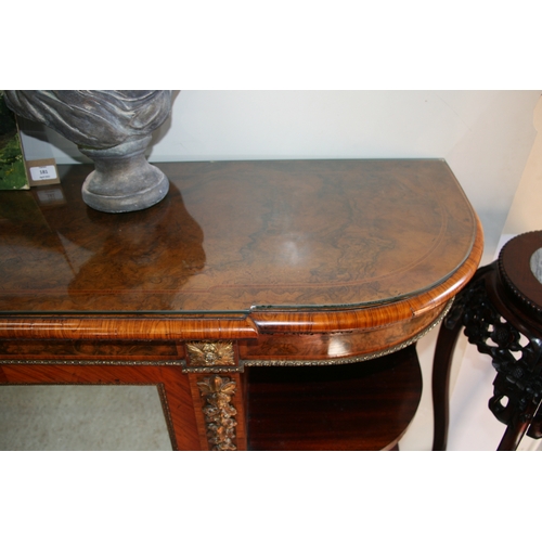 760 - A 19th century figured walnut Credenza, the pair of mirrored doors enclosing a shelved interior flan... 