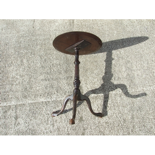 776 - An inlaid mahogany wine table on turned column and tripod base, 39cms wide; together with three simi... 