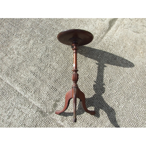 776 - An inlaid mahogany wine table on turned column and tripod base, 39cms wide; together with three simi... 