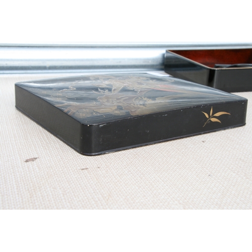 613 - A Japanese Meiji period black lacquer and chinoiserie decorated writing box, the cover decorated wit... 