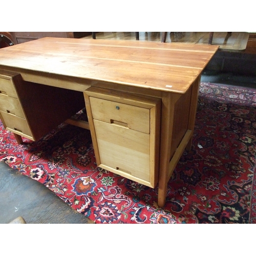 700 - A mid 20th century Danish design pedestal desk with an arrangement of six drawers, 152cms wide.