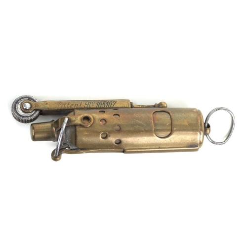 121 - A WWI trench art lighter, marked 'IMCO Patent 105107, Made In Austria', approx 7cms long.