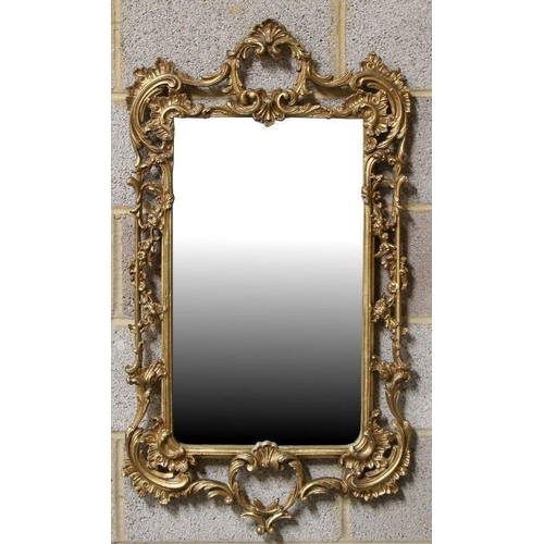 1237 - A Victorian style gilt gesso rectangular wall mirror, the plate size 53 by 38cms.