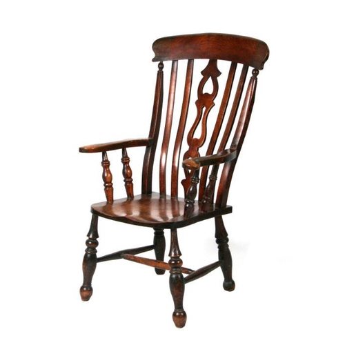 1238 - A late Victorian beech and elm farmhouse kitchen armchair with turned front legs joined by stretcher... 