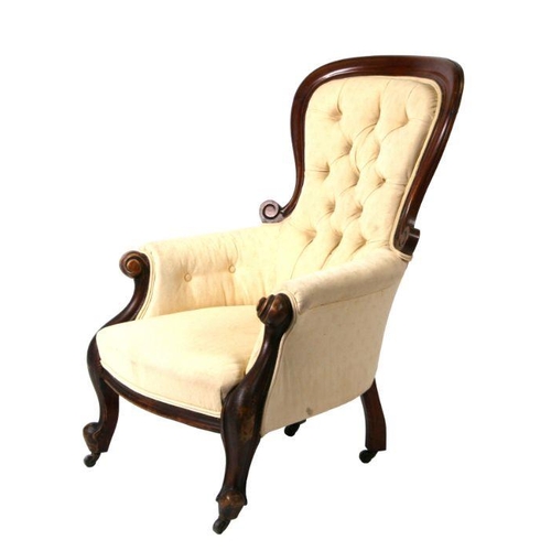 1239 - A Victorian mahogany button backed armchair.