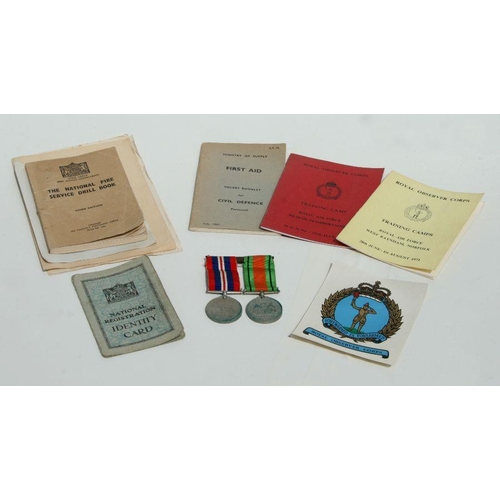 125 - A mounted WWII Defence & War Medal pair together with various WWII period Civil Defence leaflets... 