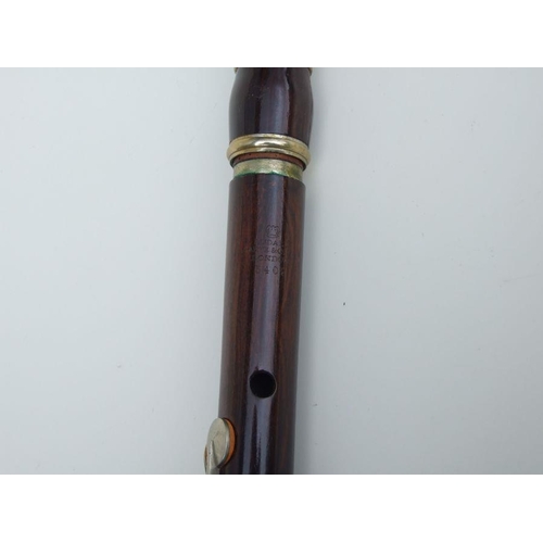 162 - A Rudall Carte & Co. Ltd rosewood flute, No. 5409, 67cms long.