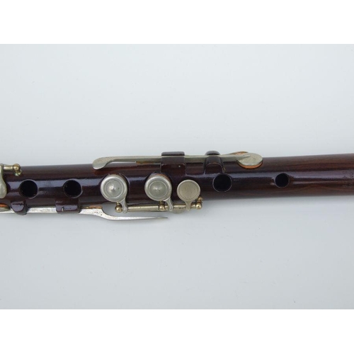 162 - A Rudall Carte & Co. Ltd rosewood flute, No. 5409, 67cms long.