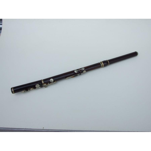 162 - A Rudall Carte & Co. Ltd rosewood flute, No. 5409, 67cms long.