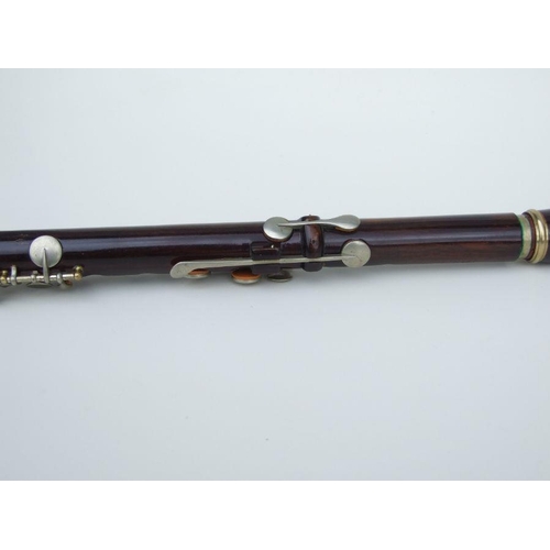 162 - A Rudall Carte & Co. Ltd rosewood flute, No. 5409, 67cms long.