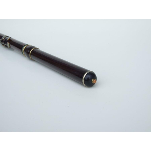 162 - A Rudall Carte & Co. Ltd rosewood flute, No. 5409, 67cms long.