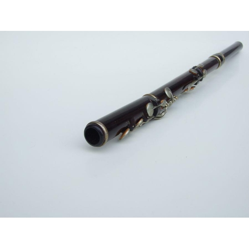 162 - A Rudall Carte & Co. Ltd rosewood flute, No. 5409, 67cms long.