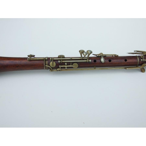 164 - A late 19th / early 20th century hardwood three-piece oboe, 56cms long.