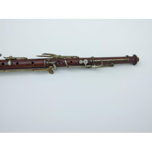 164 - A late 19th / early 20th century hardwood three-piece oboe, 56cms long.