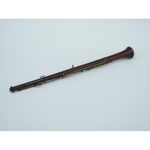 164 - A late 19th / early 20th century hardwood three-piece oboe, 56cms long.