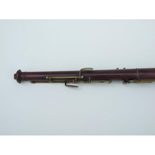 164 - A late 19th / early 20th century hardwood three-piece oboe, 56cms long.