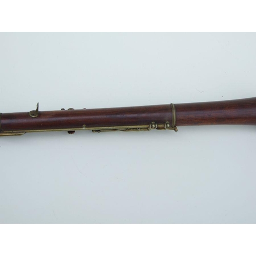 164 - A late 19th / early 20th century hardwood three-piece oboe, 56cms long.