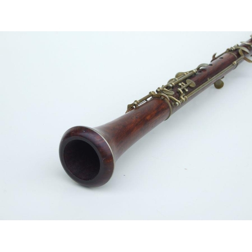 164 - A late 19th / early 20th century hardwood three-piece oboe, 56cms long.