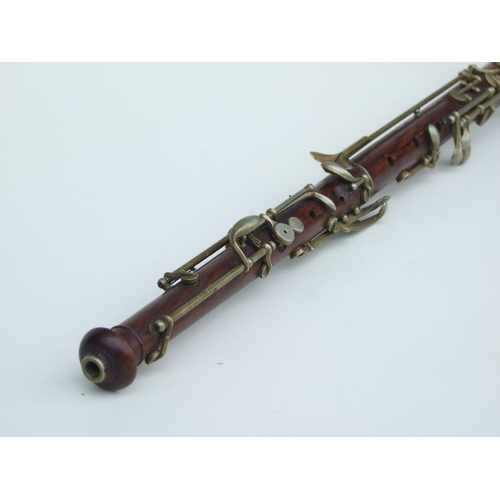 164 - A late 19th / early 20th century hardwood three-piece oboe, 56cms long.