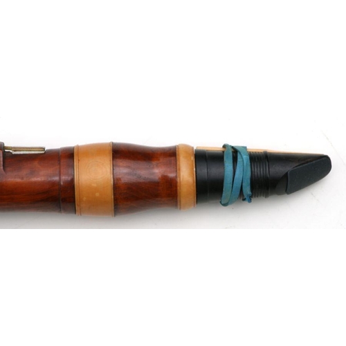 165 - A 19th century pearwood and ivory clarinet by Metzler & Co. London, 59cms long.  APHA registrati... 