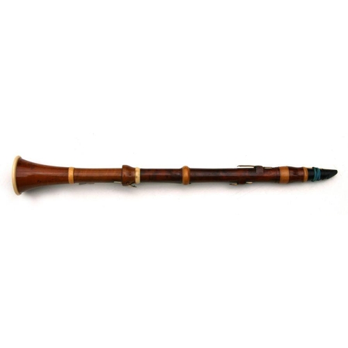 165 - A 19th century pearwood and ivory clarinet by Metzler & Co. London, 59cms long.  APHA registrati... 