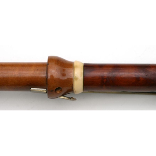 165 - A 19th century pearwood and ivory clarinet by Metzler & Co. London, 59cms long.  APHA registrati... 