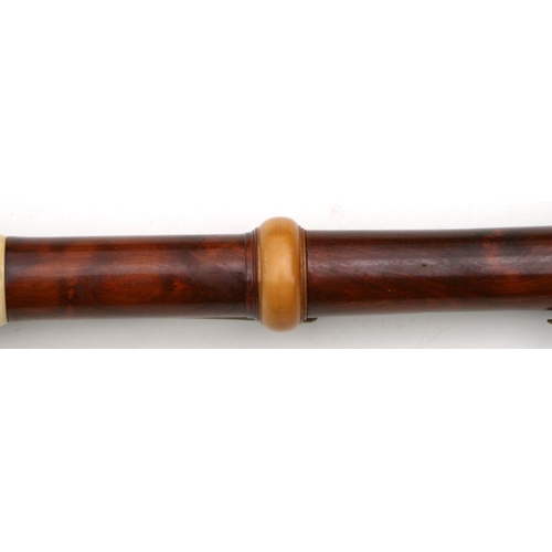 165 - A 19th century pearwood and ivory clarinet by Metzler & Co. London, 59cms long.  APHA registrati... 