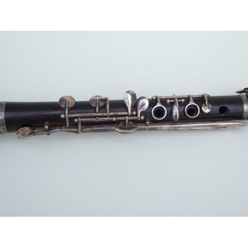 166 - A four-piece cocuswood clarinet, retailed by 'A Chappell, 52 New Bond Street, London', manufactured ... 