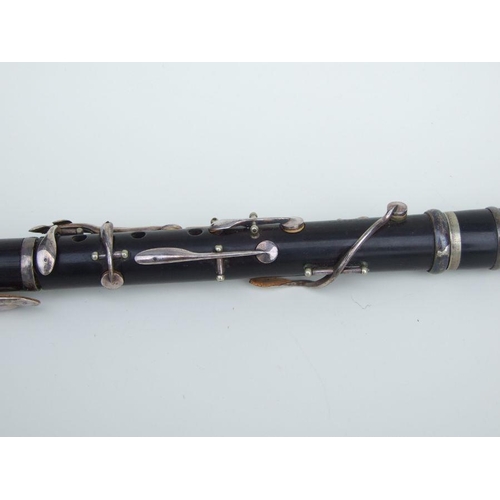 166 - A four-piece cocuswood clarinet, retailed by 'A Chappell, 52 New Bond Street, London', manufactured ... 