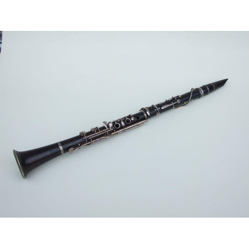 166 - A four-piece cocuswood clarinet, retailed by 'A Chappell, 52 New Bond Street, London', manufactured ... 