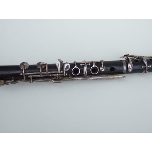 166 - A four-piece cocuswood clarinet, retailed by 'A Chappell, 52 New Bond Street, London', manufactured ... 