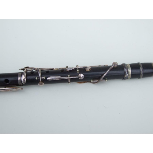 166 - A four-piece cocuswood clarinet, retailed by 'A Chappell, 52 New Bond Street, London', manufactured ... 