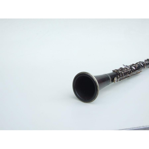 166 - A four-piece cocuswood clarinet, retailed by 'A Chappell, 52 New Bond Street, London', manufactured ... 