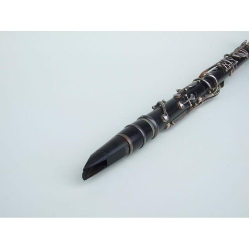 166 - A four-piece cocuswood clarinet, retailed by 'A Chappell, 52 New Bond Street, London', manufactured ... 