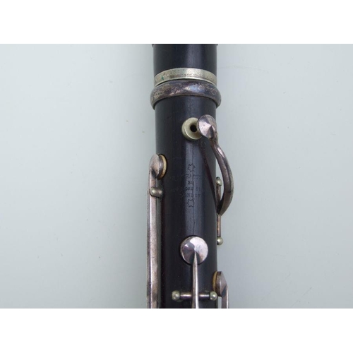 166 - A four-piece cocuswood clarinet, retailed by 'A Chappell, 52 New Bond Street, London', manufactured ... 