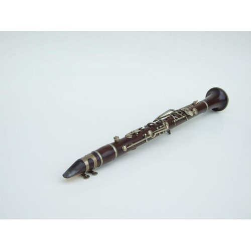 167 - A late 19th / early 20th century five-piece hardwood clarinet, the thumb support stamped 'JTL', 57cm... 