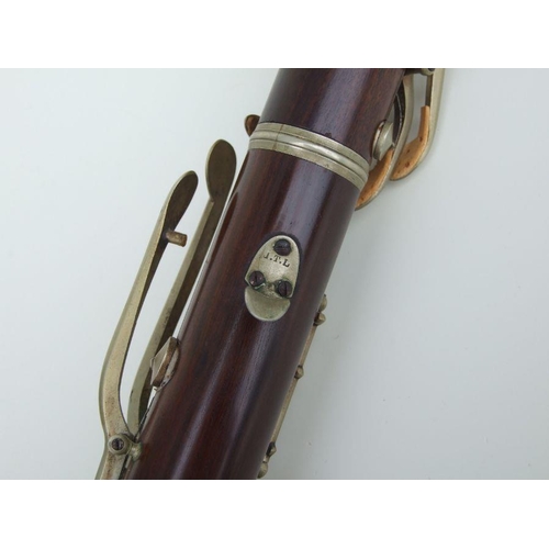 167 - A late 19th / early 20th century five-piece hardwood clarinet, the thumb support stamped 'JTL', 57cm... 