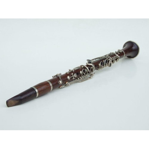 169 - A Ball Beavon & Co. five-piece rosewood clarinet, 65cms long.