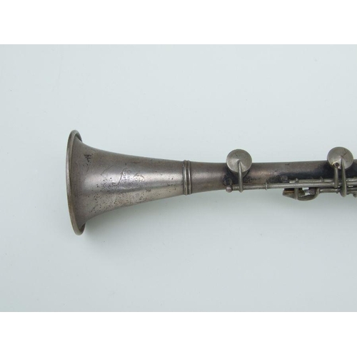 170 - An early 20th century Cleveland Musical Instrument Co. silver plated clarinet, 55cms long (missing m... 