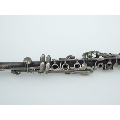 170 - An early 20th century Cleveland Musical Instrument Co. silver plated clarinet, 55cms long (missing m... 