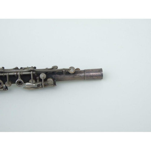 170 - An early 20th century Cleveland Musical Instrument Co. silver plated clarinet, 55cms long (missing m... 