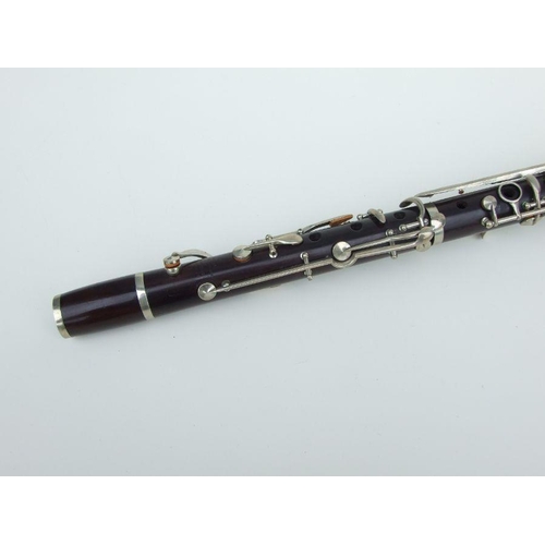 171 - A late 19th / early 20th century rosewood clarinet, retailed by 'SA Chappell, 52 New Bond Street' an... 