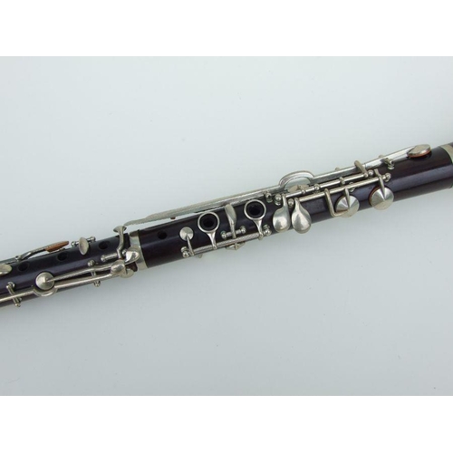 171 - A late 19th / early 20th century rosewood clarinet, retailed by 'SA Chappell, 52 New Bond Street' an... 