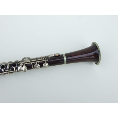 171 - A late 19th / early 20th century rosewood clarinet, retailed by 'SA Chappell, 52 New Bond Street' an... 