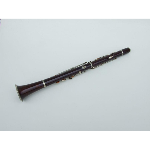 171 - A late 19th / early 20th century rosewood clarinet, retailed by 'SA Chappell, 52 New Bond Street' an... 