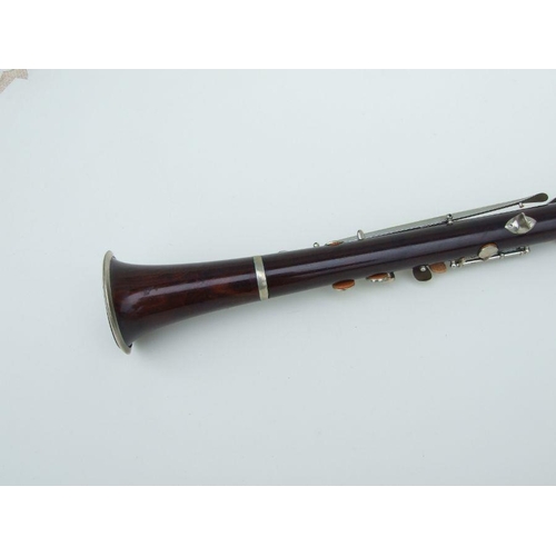 171 - A late 19th / early 20th century rosewood clarinet, retailed by 'SA Chappell, 52 New Bond Street' an... 