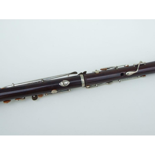 171 - A late 19th / early 20th century rosewood clarinet, retailed by 'SA Chappell, 52 New Bond Street' an... 