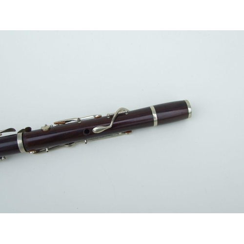 171 - A late 19th / early 20th century rosewood clarinet, retailed by 'SA Chappell, 52 New Bond Street' an... 