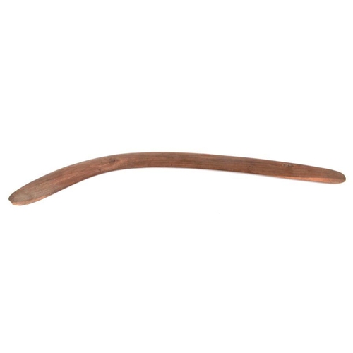 199 - An Australian Aboriginal boomerang with simple decoration, 77cms long.