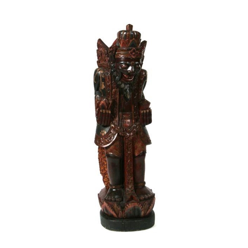 204 - A large Balinese polychrome carved wooden figure, 112cms high.